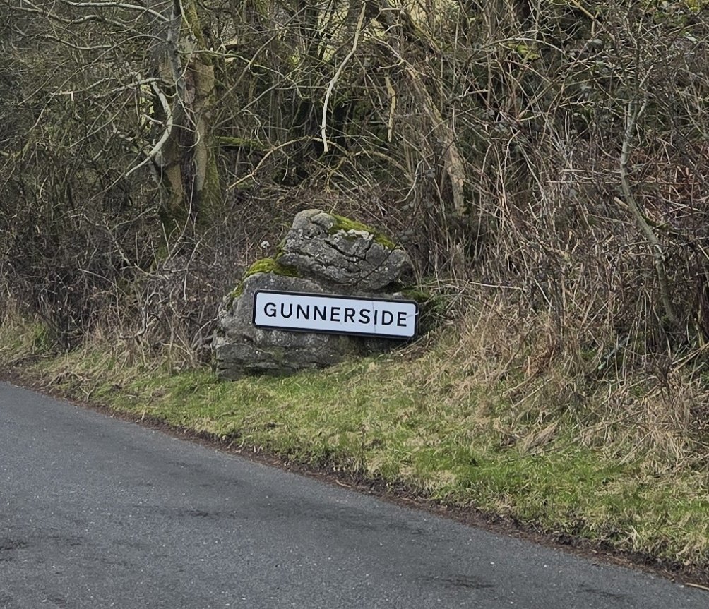 village sign reading Gunnerside